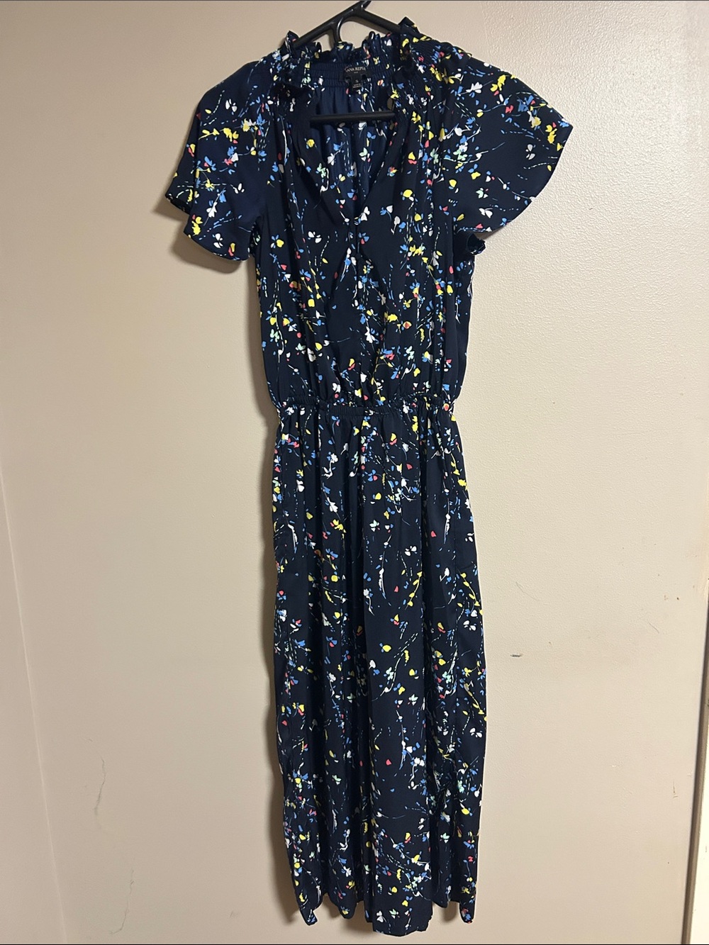 Navy Floral Flutter Sleeve Romper with Yellow & Blue Accents